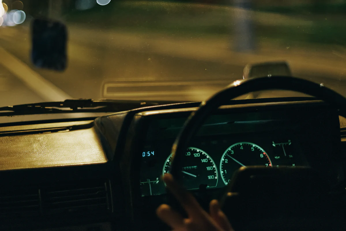 Driver at the wheel of a car at night
