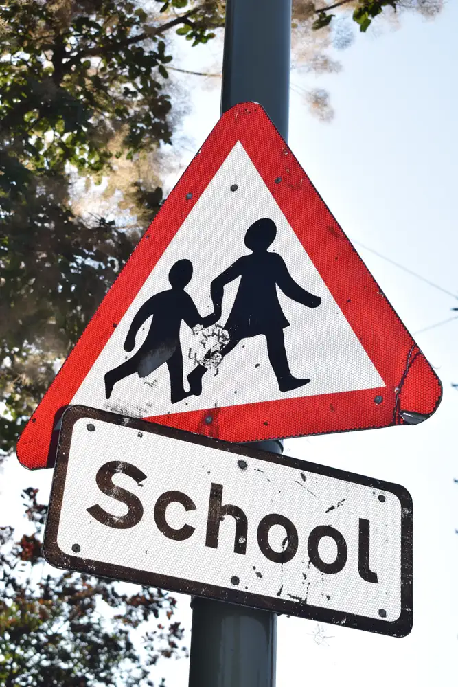 Irish road sign warning of a school and children crossing